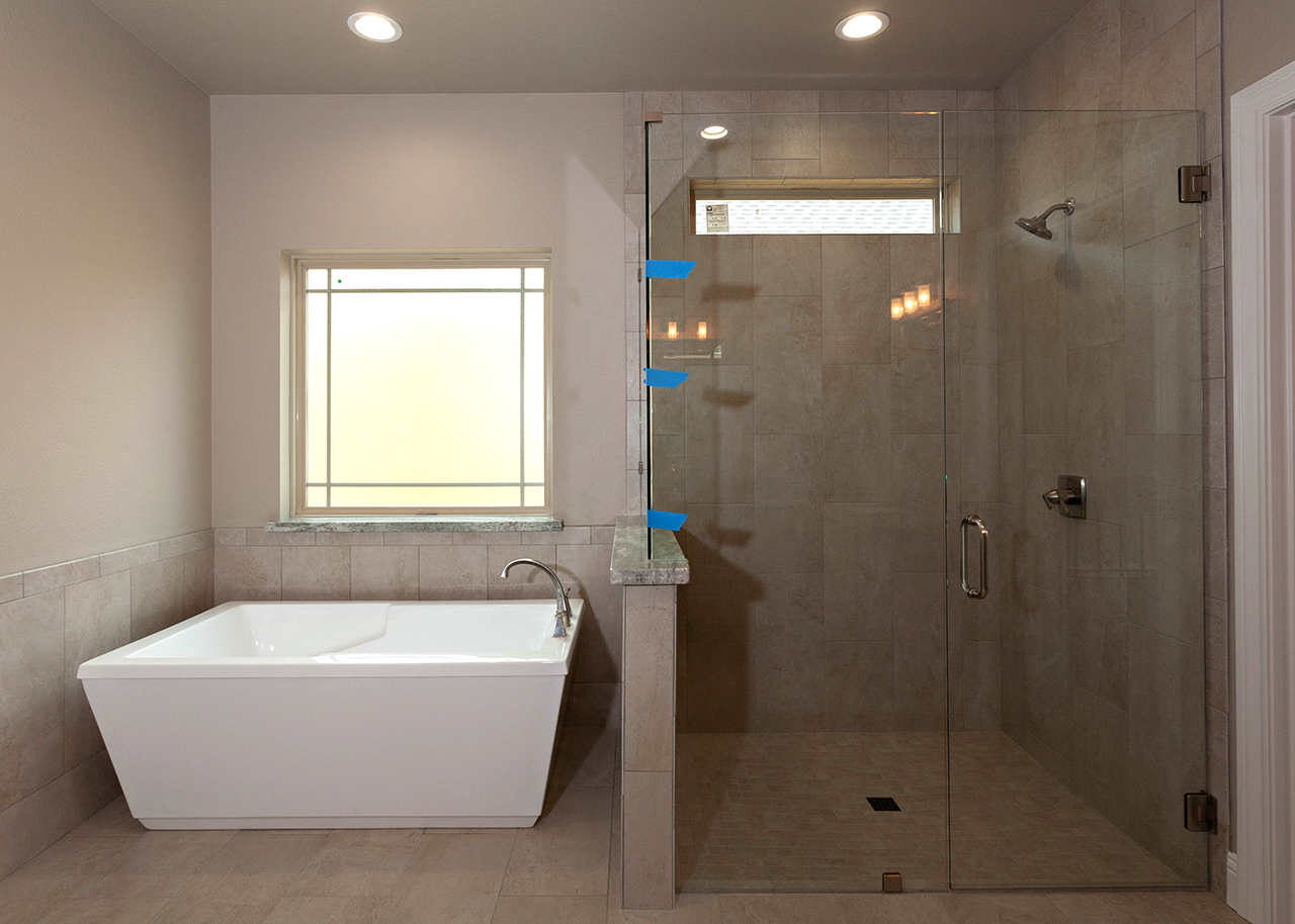 195 Hidden Grove Court Master bath with freestanding tub and glass shower