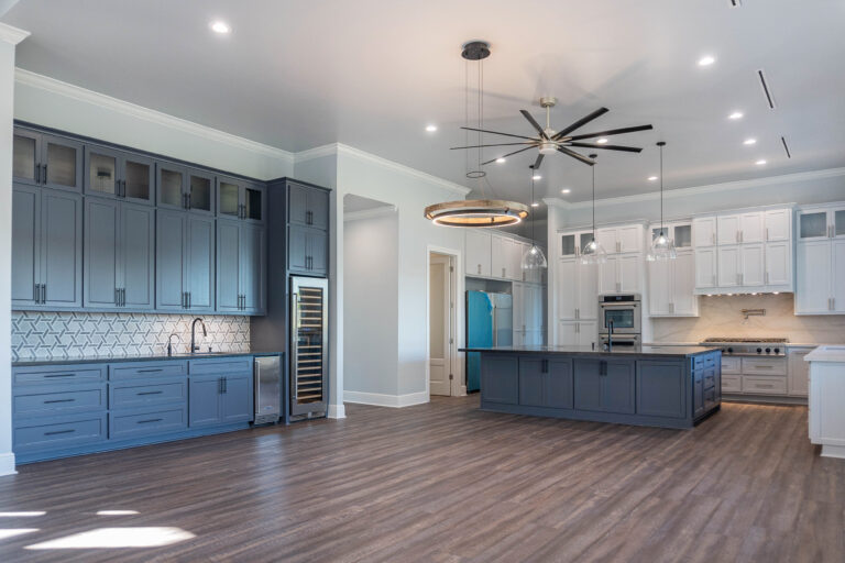 Boyt modern home kitchen and living brown wood look tile flooring blue shaker style cabinet wet bar with hexagonal backsplash modern circular light fixture