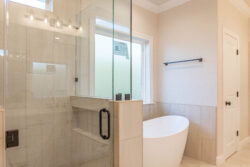 470 hidden grove court spec built home lumberton texas master bathroom glass walk in shower and tub with light gray tile backsplash