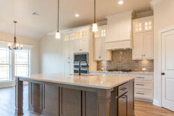 470 hidden grove court spec built home lumberton texas kitchen gray island with white marble counter top double pendant light over island